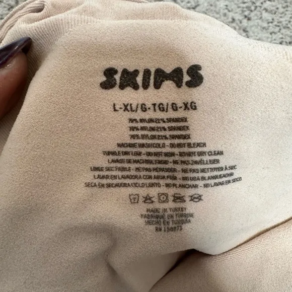 SKIMS Seamless Thong Sculpt Bodysuit in a light TAN color Sz L/XL