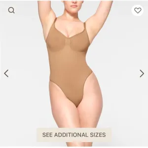 SKIMS Seamless Thong Sculpt Bodysuit in a light TAN color Sz L/XL